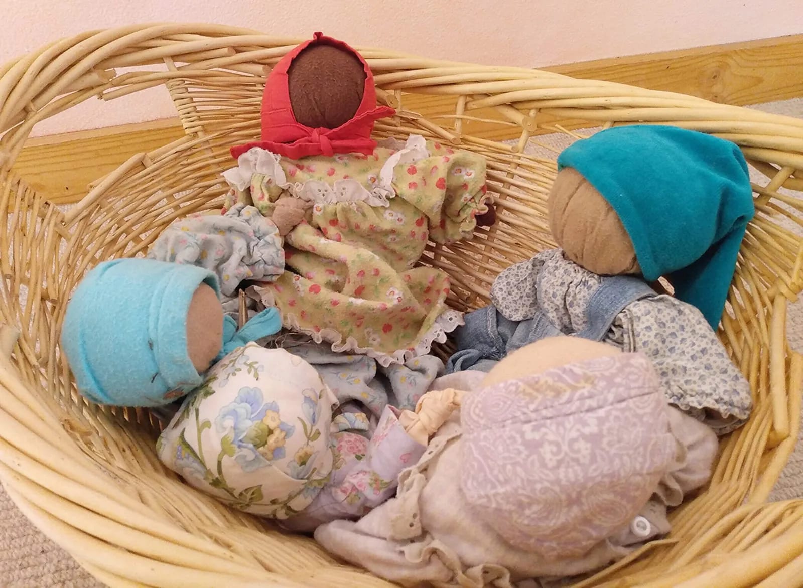 ECE dolls in basket