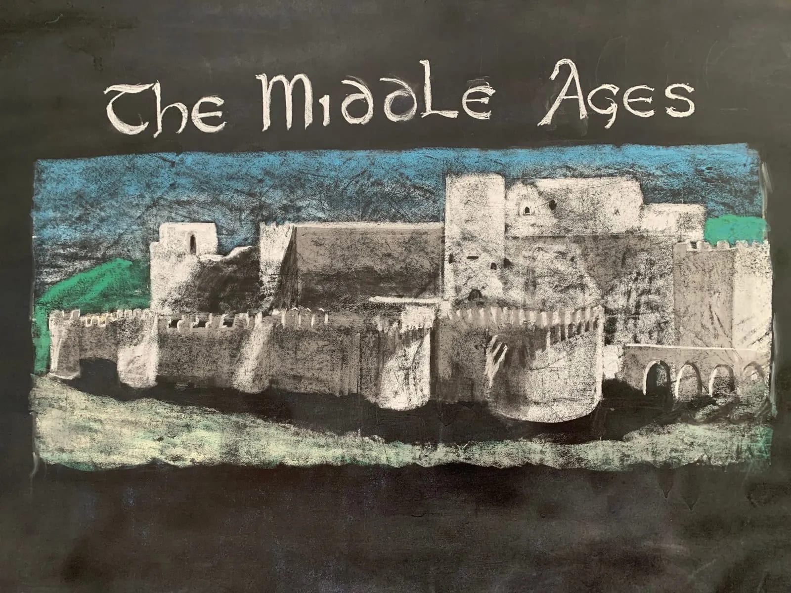 A castle chalkboard drawing accompanies Grade 6’s study of the Middle Ages.